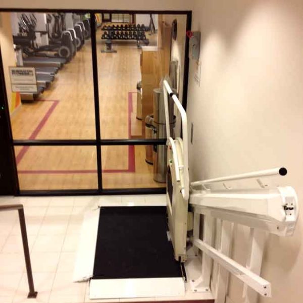 Sheraton gym wheelchair lift platform unfolded on Bedco Mobility website