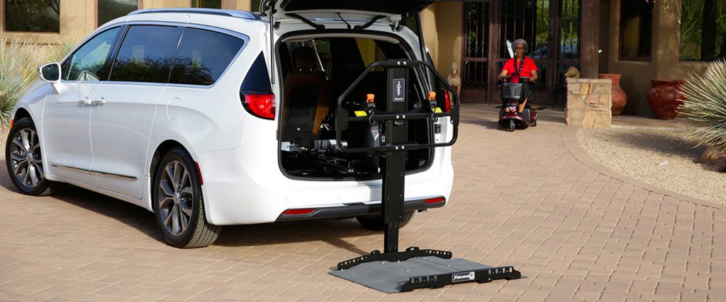 woman riding to wheelchair accessible van on Bedco Mobility website