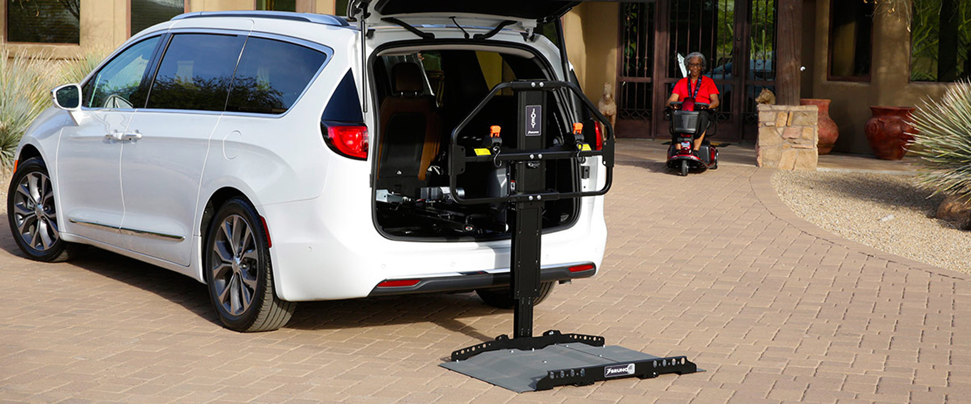 woman riding to wheelchair accessible van on Bedco Mobility website