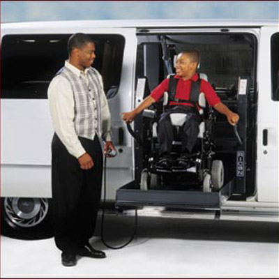 Man and child on Ricon Reliant accessible handicap wheelchair van image