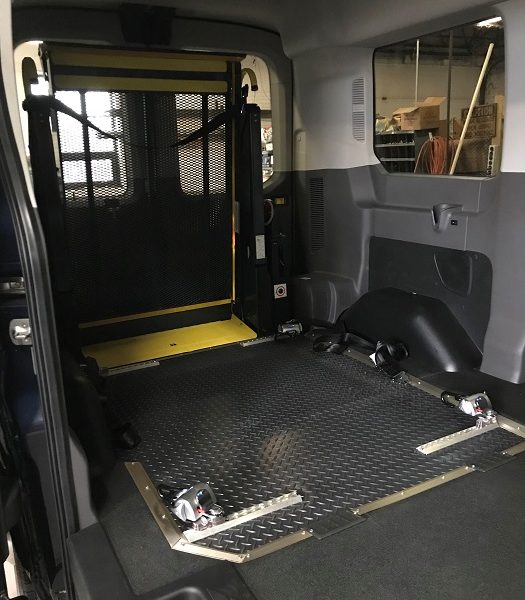 Interior of transit with wheelchair ramp and tie downs