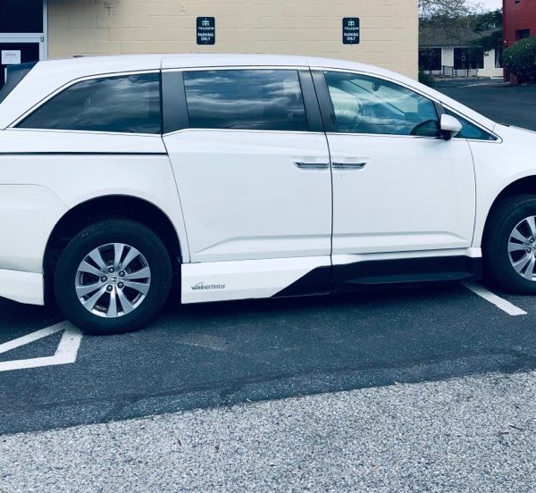 passenger side of white honda odyssey accessible minivan