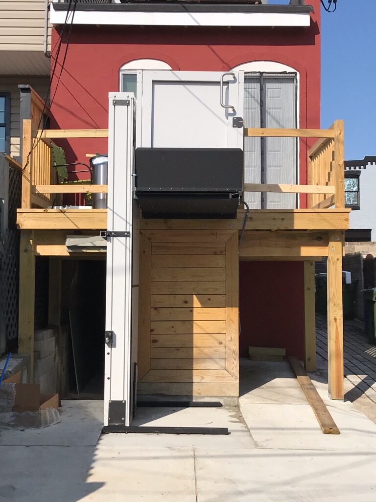 residential porch lift raised at top landing